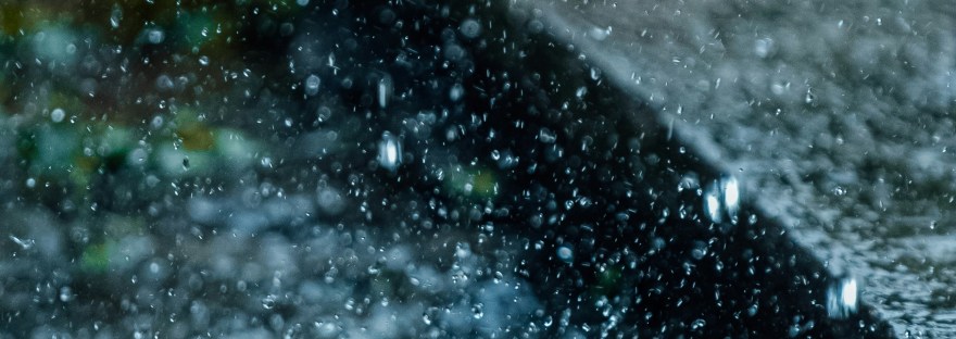 Raindrops fall into mud.